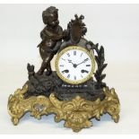 C20th French patinated and gilt spelter Figural mantel clock set with artist cherub, circular