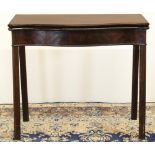 George III mahogany serpentine tea table, moulded folding top on canted square supports, W84cm D84cm