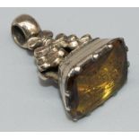 Yellow metal Georgian seal fob set with citrine intaglio of running dog inscribed 'When This Dog
