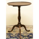 George III mahogany tripod table, circular snap top with moulded border on slender vase turned