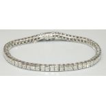 18ct white gold tennis bracelet with tongue and box closure, set with 64 princess cut diamonds,