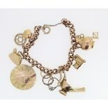 9ct yellow gold charm bracelet stamped 375, set with 9ct yellow gold and yellow metal charms,