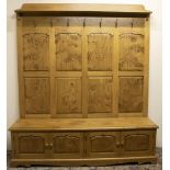 Stewart Linford Furniture - an oak hallstand, raised back with shelf cornice, seven metal hooks