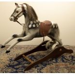 Ragamuffin Toys Ltd. of Guernsey - a fibreglass rocking horse, painted dappled with real horse