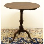 George III mahogany tripod tea table, circular top on vase turned column support with three