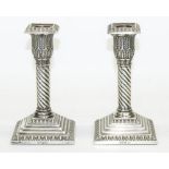 Pair of small Edw.VII hallmarked silver candlesticks, lobed acanthus sconces on wrythen columns