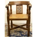 Robert "Mouseman" Thompson of Kilburn - an oak Monks chair, curved top rail with three lattice