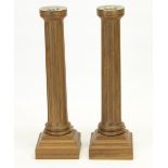David Linley - pair of walnut candlesticks, fluted columns on stepped square bases, stamped