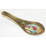 C19th Japanese Canton rice spoon, decorated in Famile enamels with figures in reserve panel on a