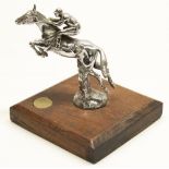 After Charles Paillet, a chromed metal car mascot, in the form of a race horse and jockey taking a