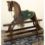 Stevenson Brothers - a chestnut coloured walnut rocking horse, with horse hair mane and tail,