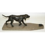 C20th patinated spelter model of a Hound with a grounded game bird, on later polished marble base,