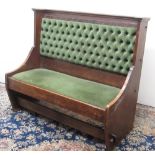 C20th oak upholstered bench seat with solid end supports and stretcher, W126cm D60cm H110cm