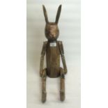 C20th carved and painted articulated rabbit, seated H38cm