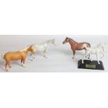 Three small Beswick Horses and Springtime foal on plinth