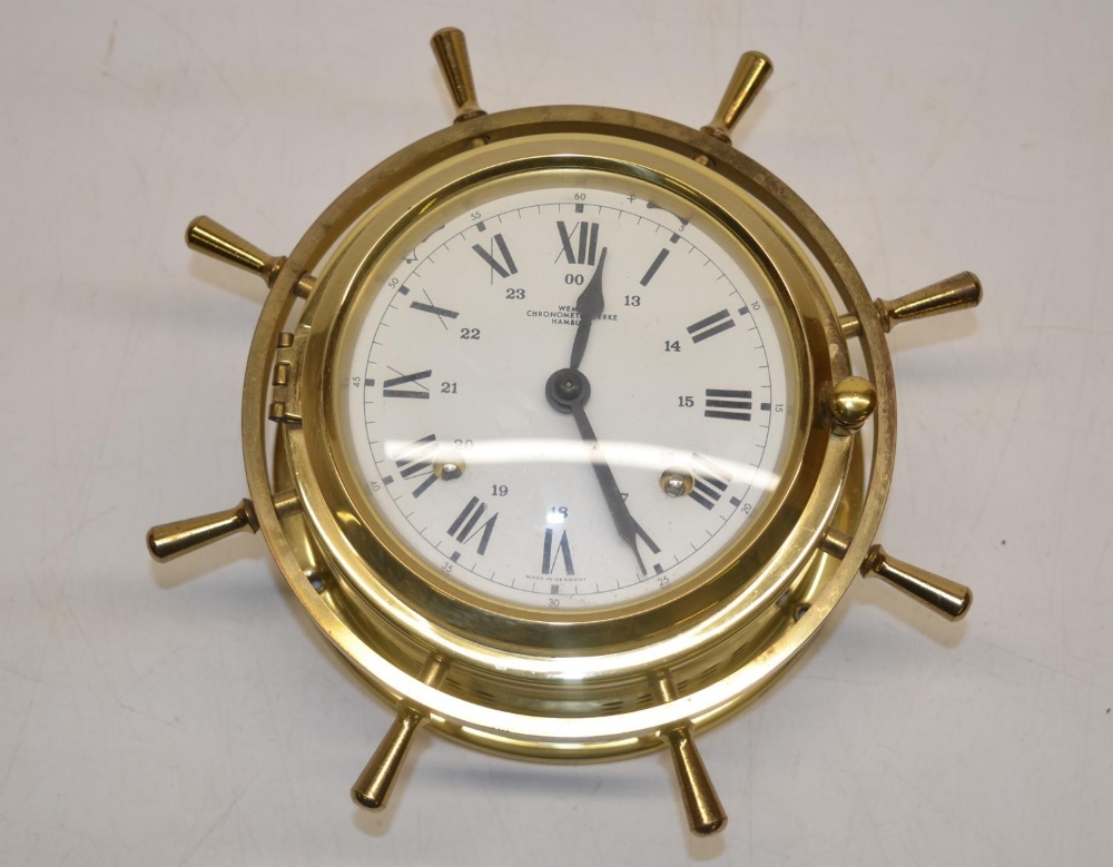 Wempe Chronometerwerke Hamburg, C20th brass bulk head type clock, in the form of a ships wheel,