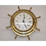 Wempe Chronometerwerke Hamburg, C20th brass bulk head type clock, in the form of a ships wheel,