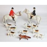Beswick Hunting group of Huntsman and Huntswoman on dapple greys with eight hounds and a running fox