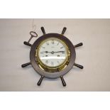 Schatz C20th brass and stained mahogany bulk head type clock in the form of a ships wheel, signed