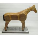 Hand crafted wooden laminated standing horse on plinth H46.5cm, an elm quartz wall clock of sporting