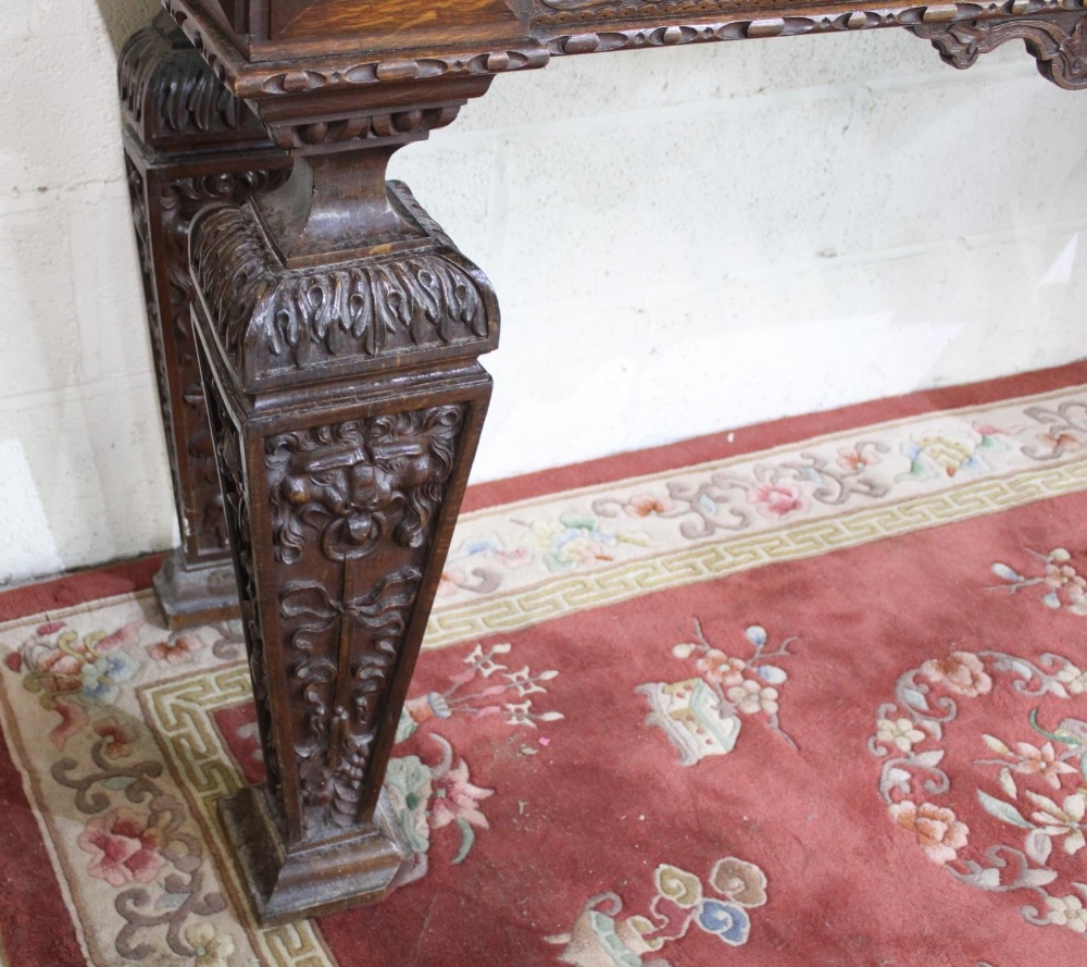 Victorian Jacobeathan revival oak side table, raised back carved with scrolls and foliage, on square - Image 4 of 4