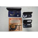 Four Moore And Wright micrometers, all with original cases, a small set of calipers by King Dick,