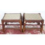 Pair of rustic oak stools, upholstered tops on square faceted supports with fretwork stretchers,