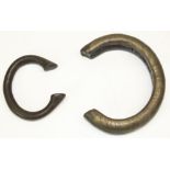 Two West African bronze manilla bracelets, max. 12cm