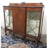 Geo.III style mahogany breakfront display cabinet, with shell carved back above two astragal