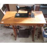 Singer Treadle sewing machine on folding oak base with two drawers