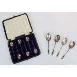 Cased set of six hallmarked silver coffee spoons with bean finials, Sheffield 1904, and four