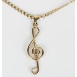 9ct yellow gold treble clef pendant necklace, L4.3cm, on a 9ct yellow gold flat curb link chain,