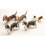 Two Beswick Springer Spaniels, model #3135, another Beswick Springer Spaniel, and two Beswick basset