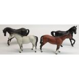 Three Beswick matt glaze stallions in black, bay, and dapple grey, and another horse stamped Royal