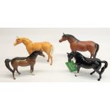 Beswick dun horse, H19cm, Beswick arab stallion, H16cm, and two Royal Doulton horses (4)