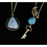 Two yellow metal and opal pendants, one doublet cut opal with Ram design to the reverse with clasp