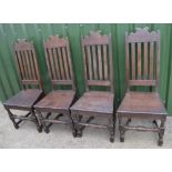 Set of four C18th country made oak dining chairs, with slat backs and solid seats on turned supports