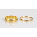 Hallmarked 22ct gold wedding band, 4.7g size Q, and an 18ct gold ring marked 750, 1.0g size T