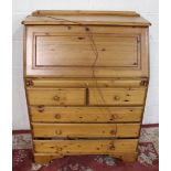 Ducal pine bureau with fall front above two short and three long drawers on plinth base, W86cm D46cm