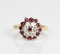 18ct yellow gold ruby and diamond cluster ring, stamped 750, size L, 5.3g