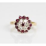 18ct yellow gold ruby and diamond cluster ring, stamped 750, size L, 5.3g