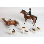 Two Beswick Huntswoman on brown horses (1 A/F) and five hounds