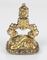 Victorian yellow metal and carnelian seal, body repousse decorated in acanthus leaves with flared