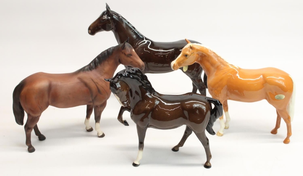 Three Beswick bay stallions and a Beswick dun stallion, max. H23.5cm