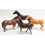 Three Beswick bay stallions and a Beswick dun stallion, max. H23.5cm
