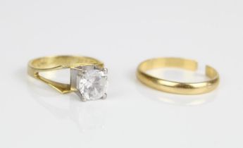18ct yellow gold ring set with clear stone in white metal mount and an 18ct yellow gold band,