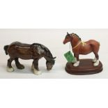 Royal Doulton heavy horse on wooden plinth, H18cm, and a Beswick figure of a shire grazing, H14cm (