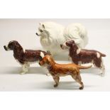Goebel dogs: Pomeranian, H21cm, two Springer Spaniels, H17cm, and a Golden Retriever
