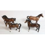 Three Beswick brown horses and a Welsh Cob