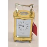 David Peterson England, late C20th brass cased carriage clock, signed white Roman dial with outer